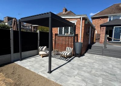 Completed garden landscaping Braintree - pergola and porcelain patio with outdoor seating