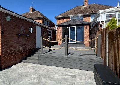 Completed garden landscaping Braintree - decking and rope rail with garden storage box