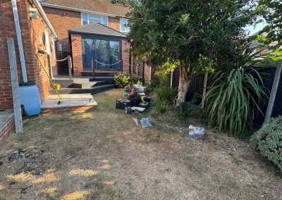 Garden before landscaping Braintree - dry lawn and construction tools scattered