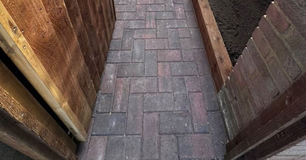 New block paving path, gate and sleeper planter bed by LNJ Maintenance